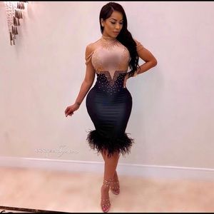 Sparkly dress with feathers